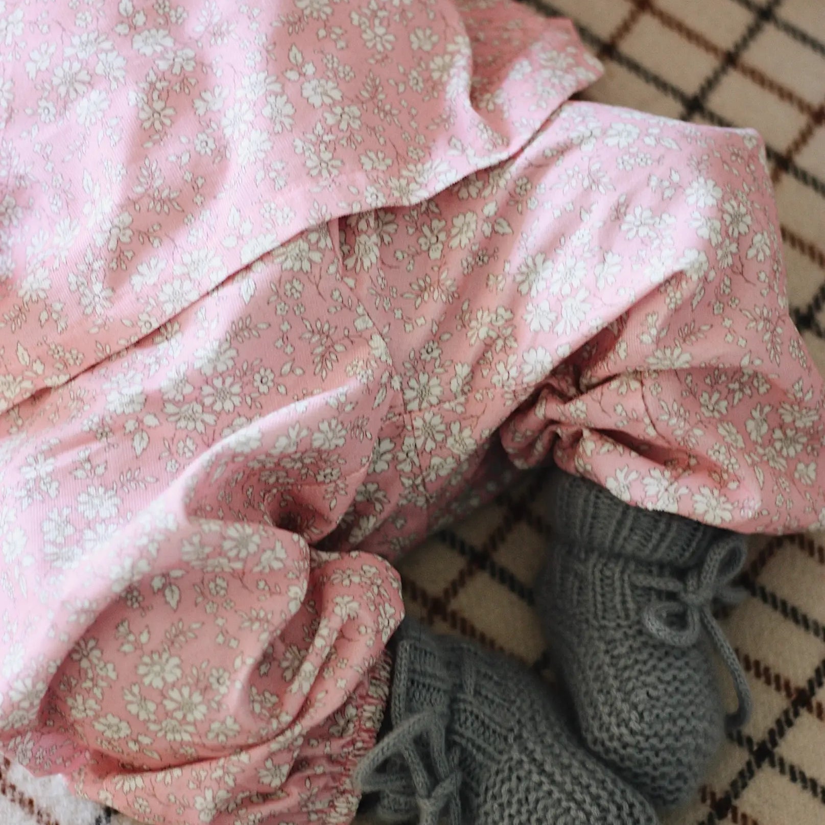 Baby wearing Lalaby knitted Alpha shoes in dove blue cashmere
