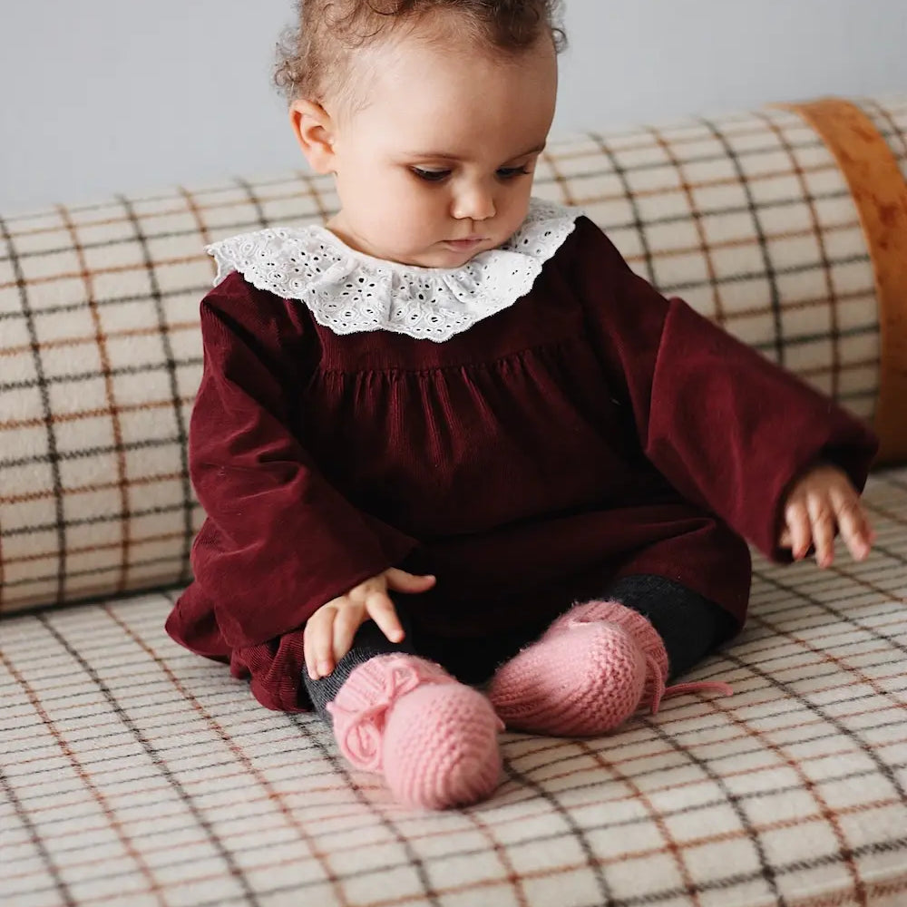 Baby girl wearing Lalaby Alpha shoes in sorbet pink cashmere