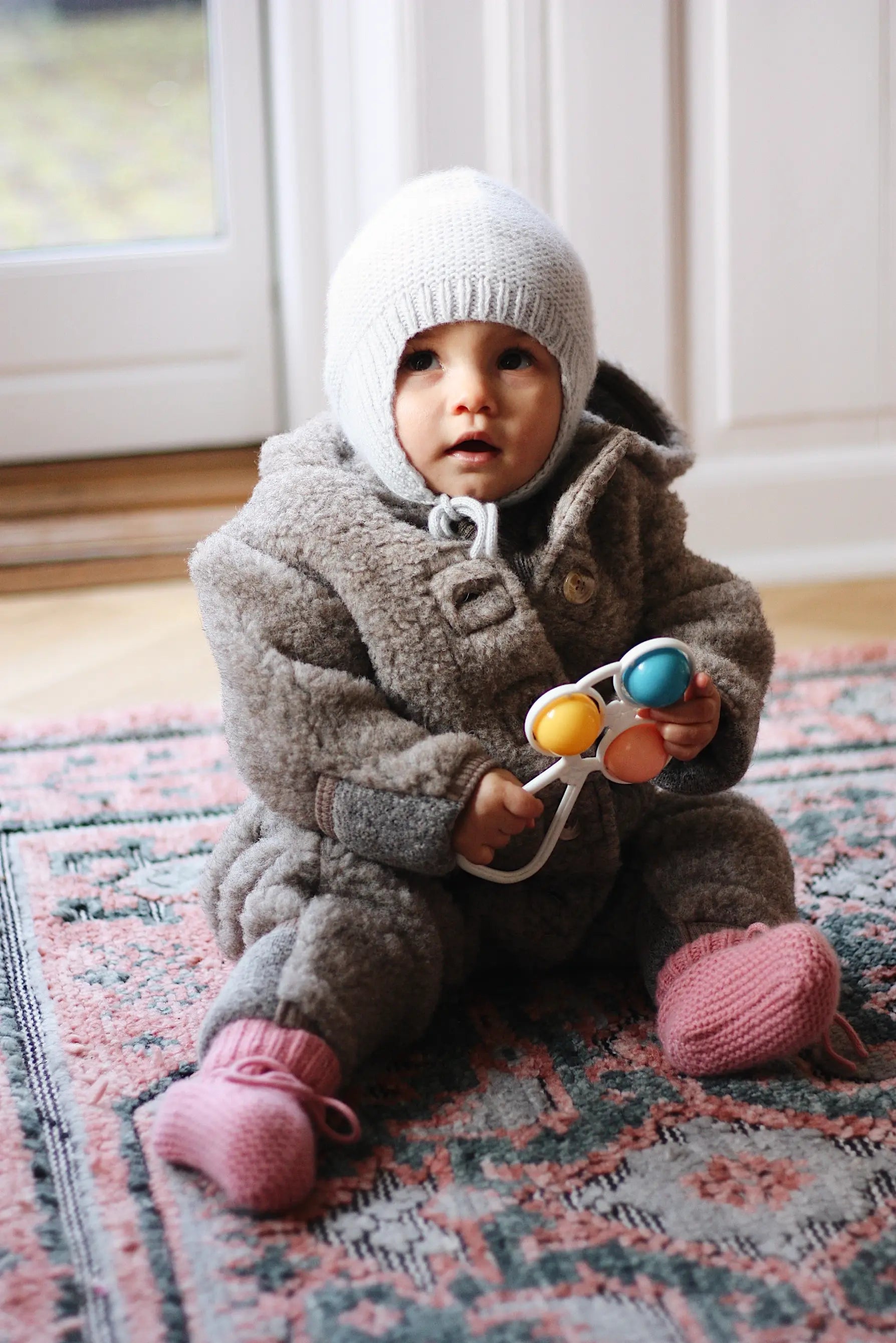 Baby girl wearing Lalaby Alpha shoes in sorbet pink cashmere