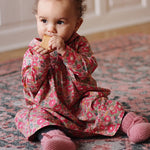 Baby girl wearing Lalaby Alpha shoes in sorbet pink cashmere