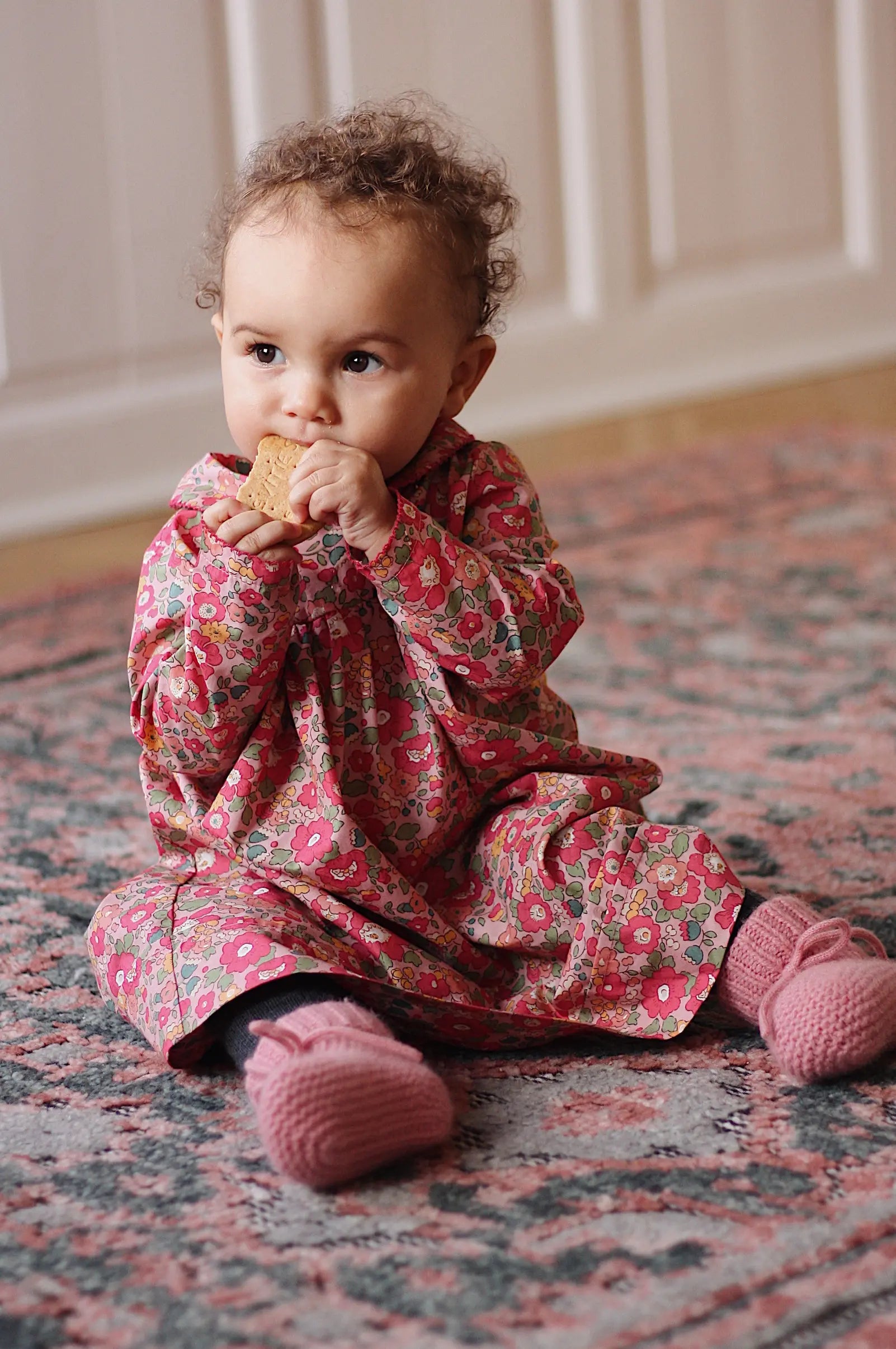 Baby girl wearing Lalaby Alpha shoes in sorbet pink cashmere