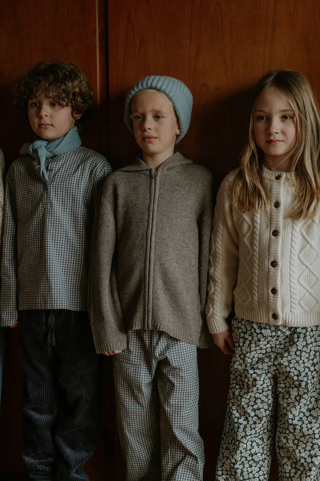 Boy wearing Lalaby Andy hoodie for kids in a millet brown baby wool, yak and cashnere blend
