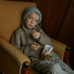 Boy wearing Lalaby Andy hoodie for kids in a millet brown baby wool, yak and cashnere blend