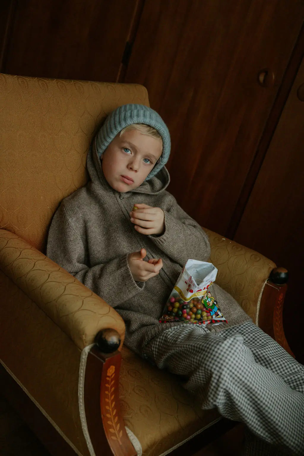 Boy wearing Lalaby Andy hoodie for kids in a millet brown baby wool, yak and cashnere blend