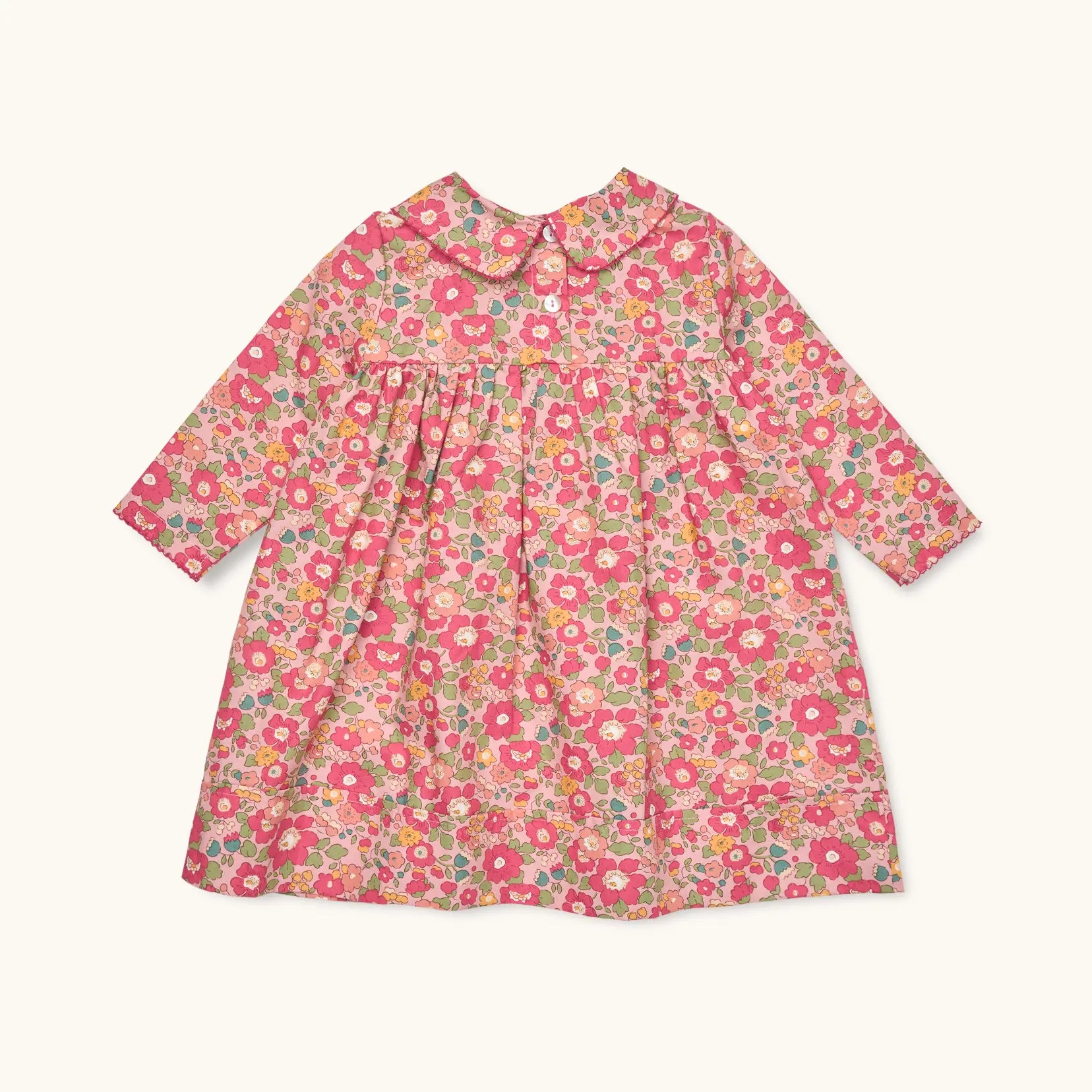 Lalaby Anna dress for babies in berry betsy pink liberty organic cotton