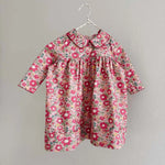 Lalaby Anna dress for babies in berry betsy pink liberty organic cotton
