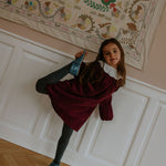 Girl wearing Lalaby Annabella dress for kids in ruby red cotton baby cord
