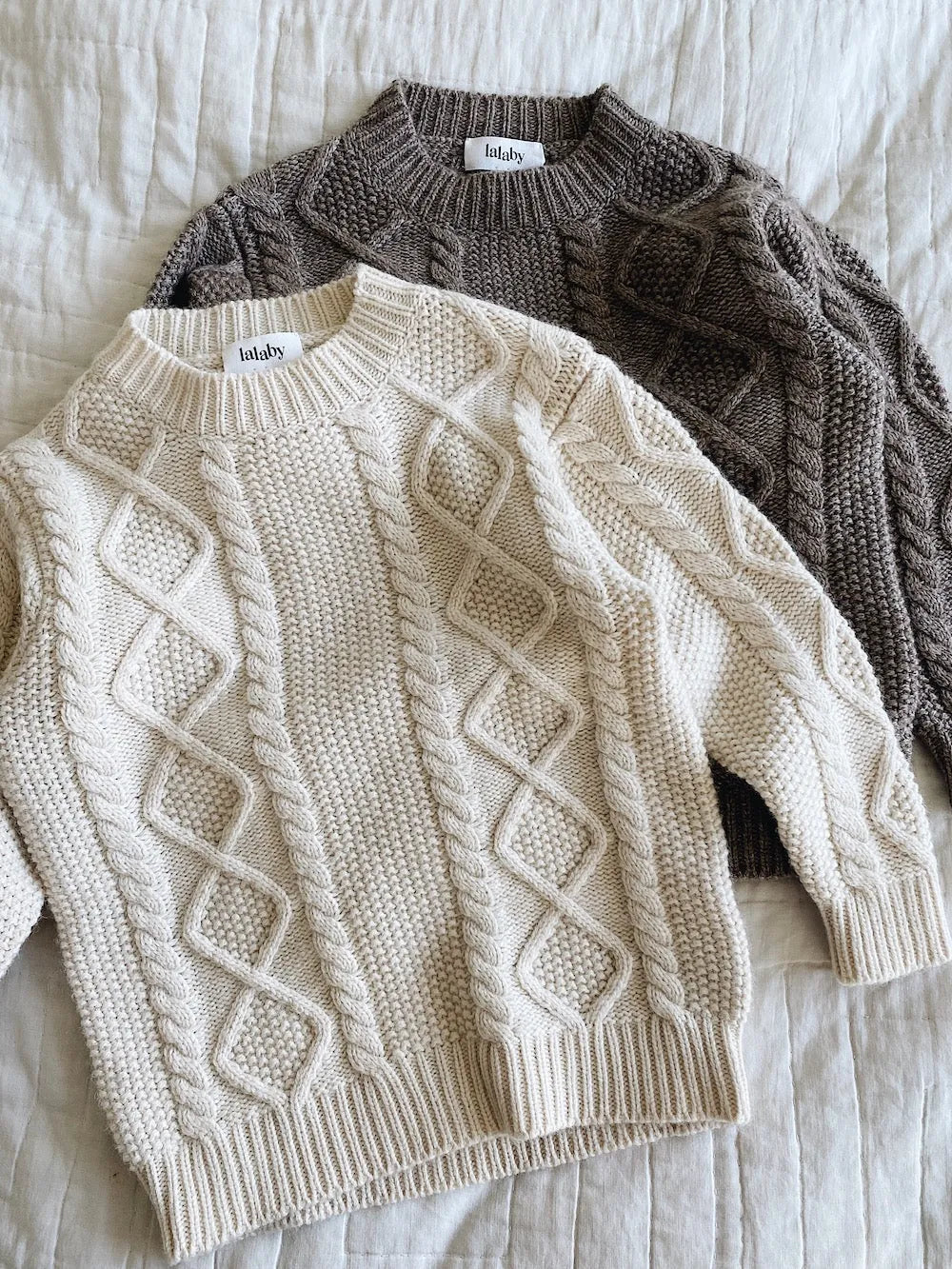 Lalaby Aran sweaters for kids in natural white and millet brown merino wool