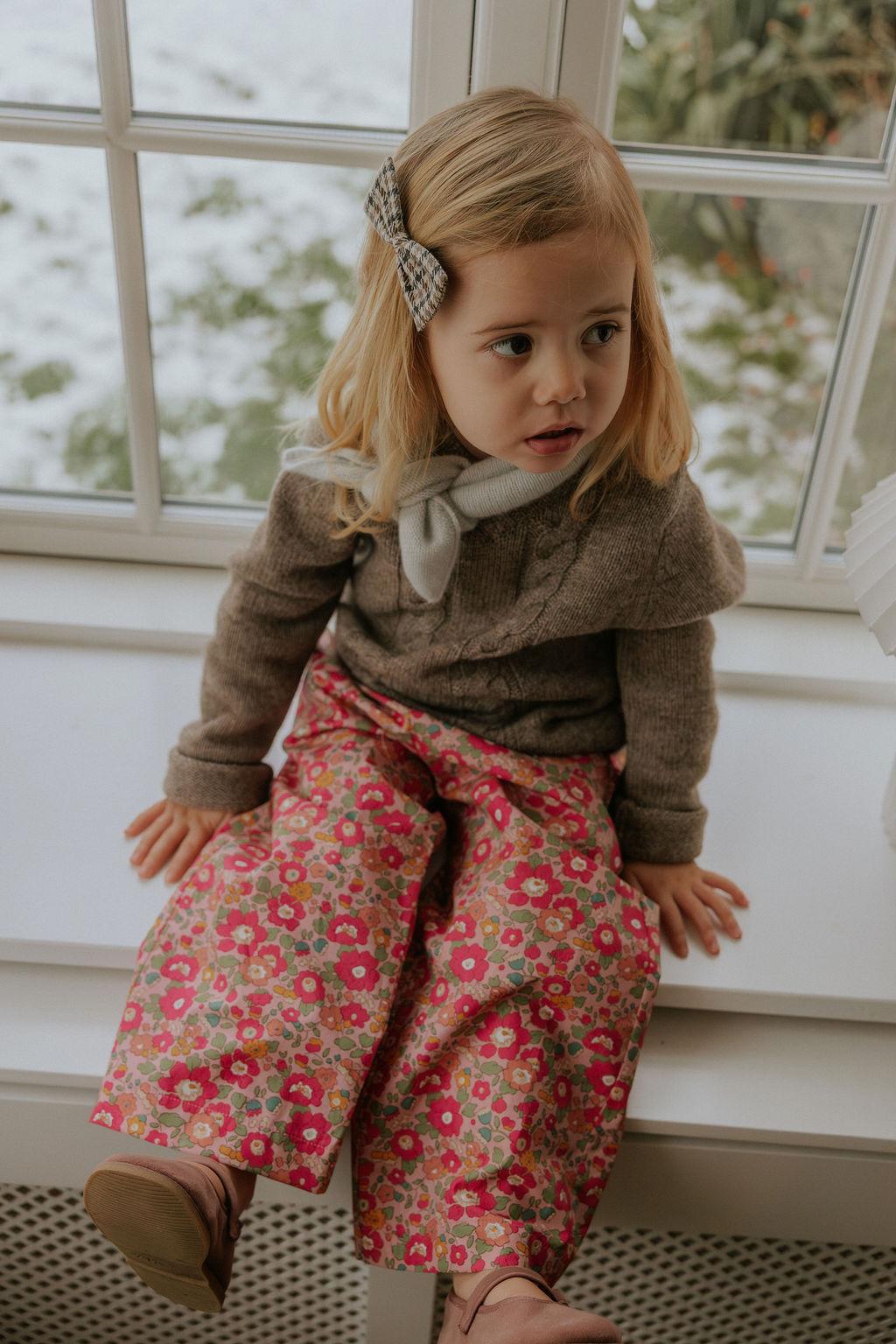 Girl wearing Lalaby Atlas scarf in bluey light blue cashmere