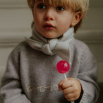 Boy wearing Lalaby Atlas scarf in bluey light blue cashmere