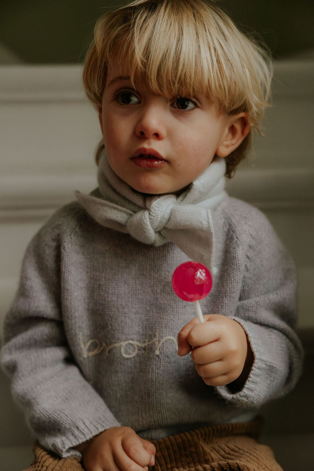 Boy wearing Lalaby Atlas scarf in bluey light blue cashmere