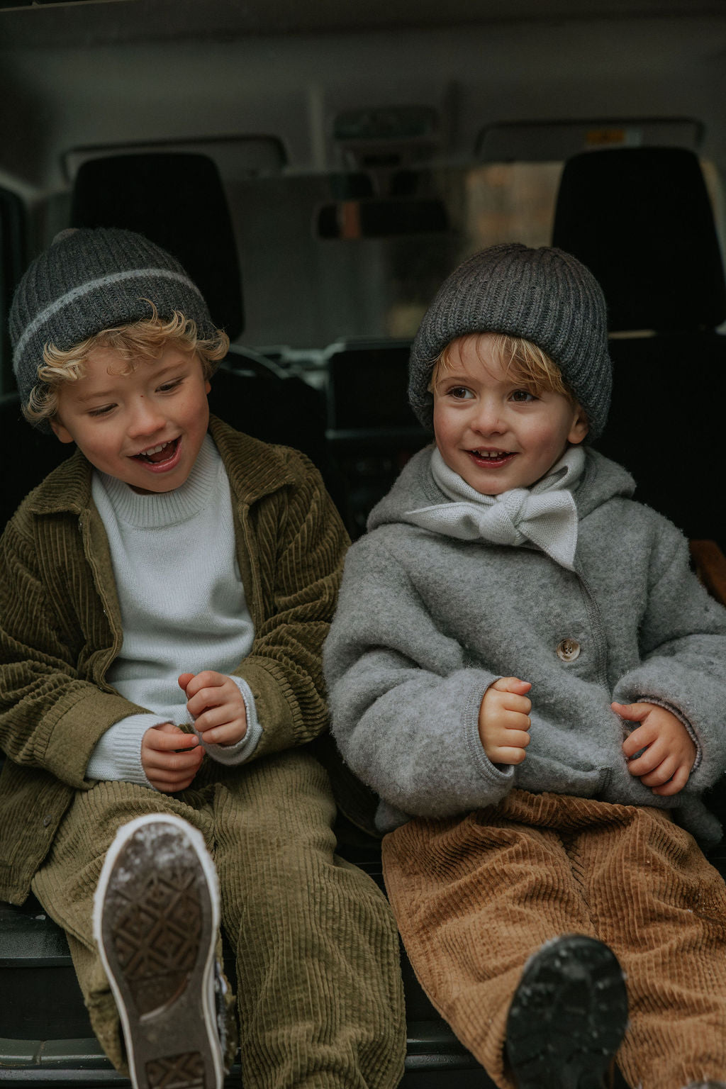 Boy wearing Lalaby Atlas scarf in bluey light blue cashmere