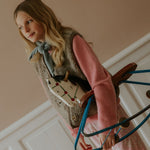 Girl wearing Lalaby Atlas scarf in dove blue cashmere