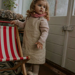 Girl wearing Lalaby Atlas scarf in sorbet pink cashmere