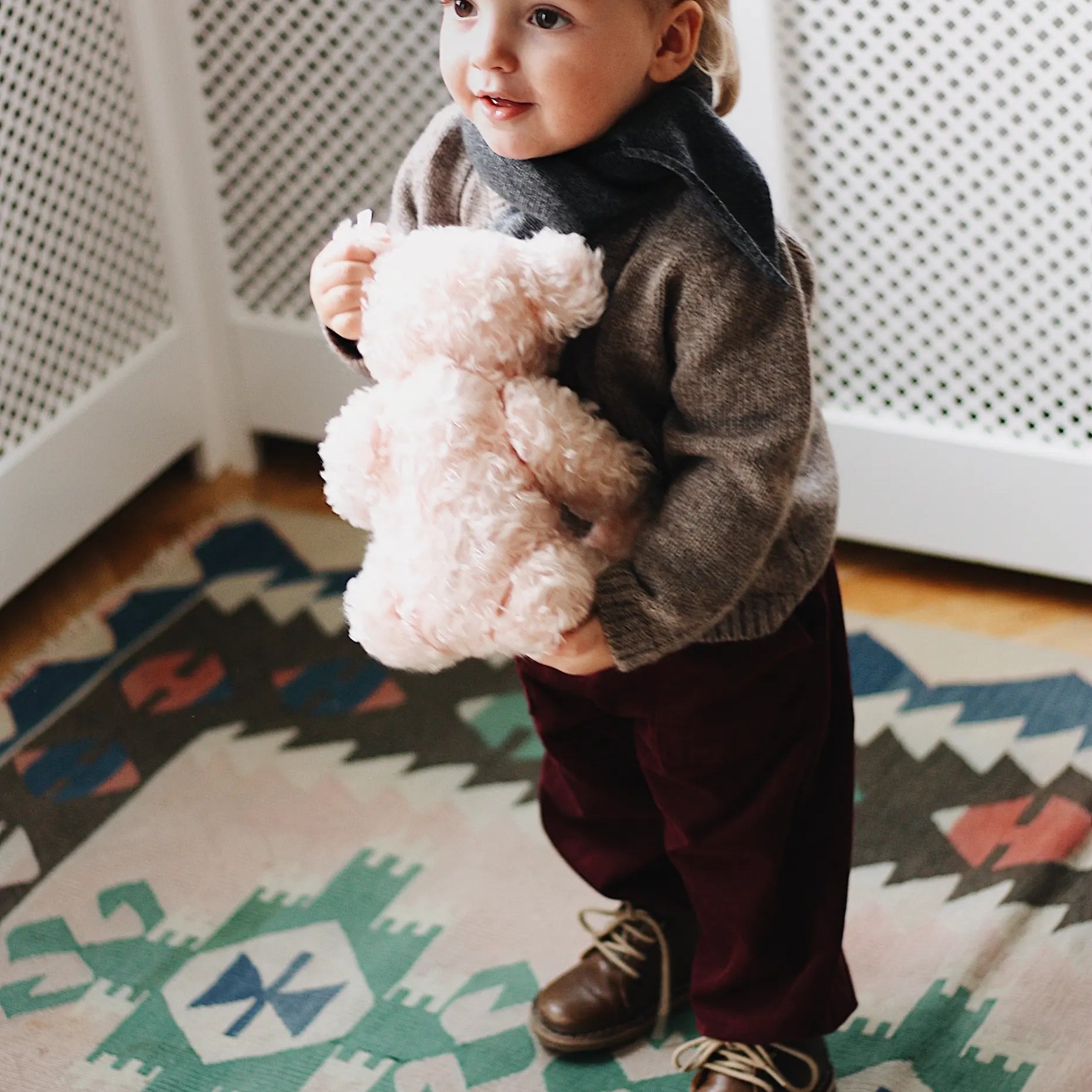 Baby boy wearing Lalaby Atlas scarf for babies, kids and adults in storm grey cashmere