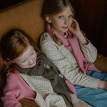 Girl wearing Lalaby Atlas scarf big in sorbet pink cashmere