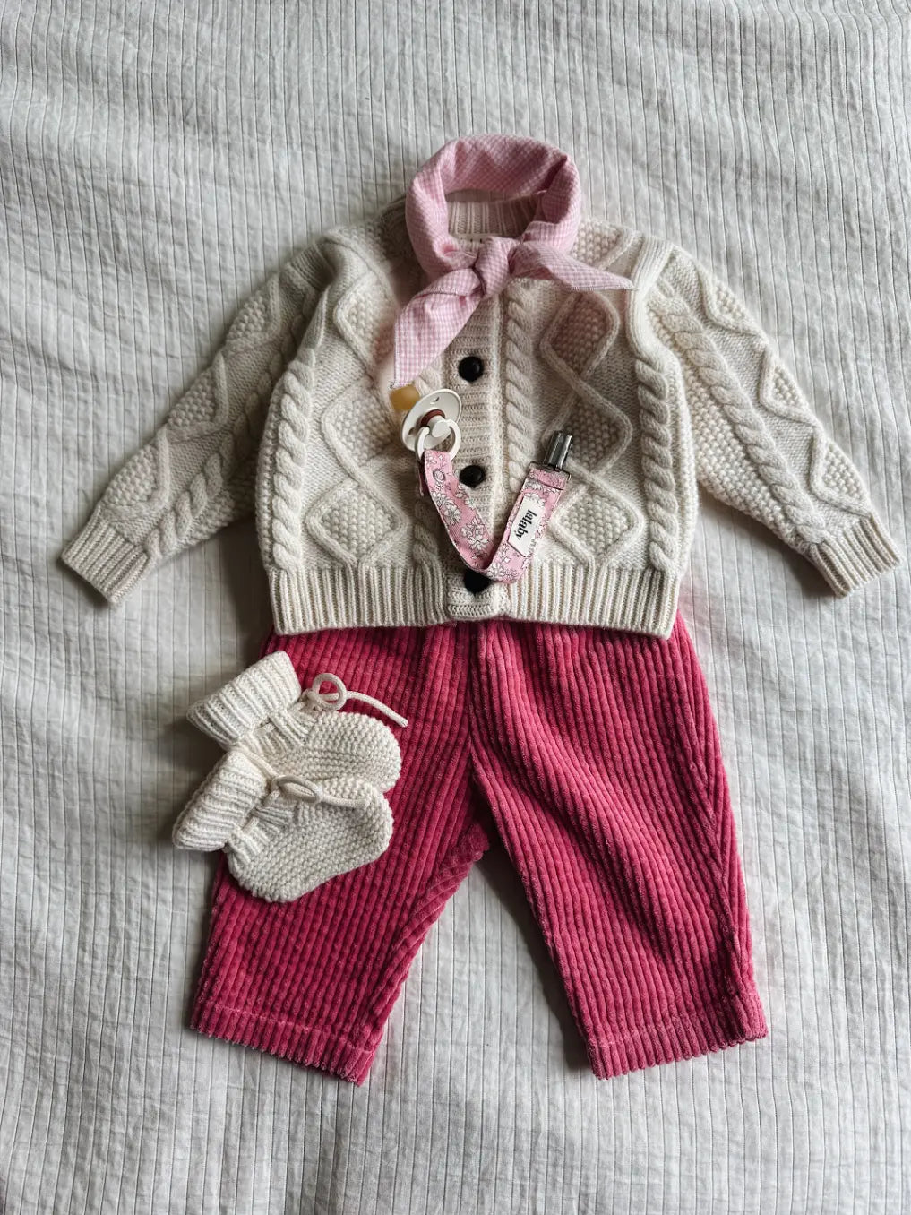 Lalaby AW26 baby girl look in shades of natural, flamingo, pink flower cord & tiny check pink