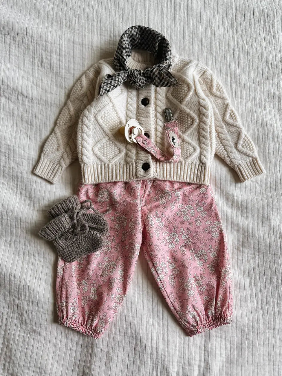 Lalaby AW26 baby girl look in shades of natural, pink flower cord, tweedy & millet