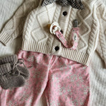 Lalaby AW26 baby girl look in shades of natural, pink flower cord, tweedy & millet