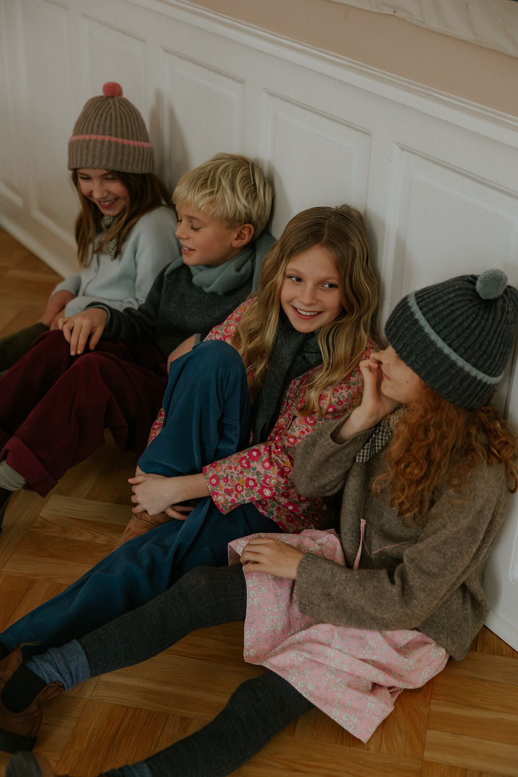 Boy wearing Lalaby Axel trousers for kids in ruby red cotton baby cord