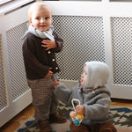 Baby boy wearing Lalaby Babar baby jacket in elephant grey merino wool