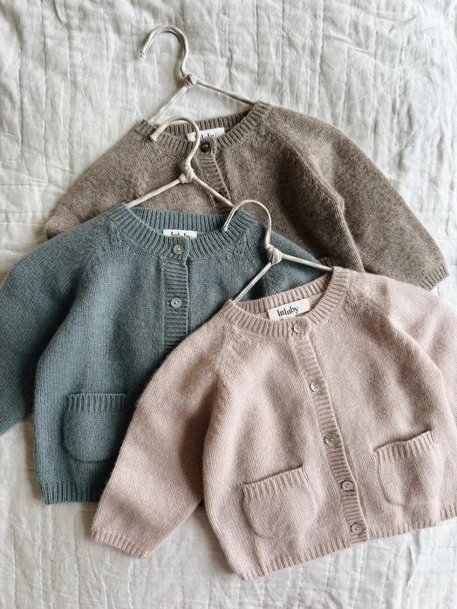 Selection of Lalaby Bobbie cardigans for babies in powder pink, dove blue and toast brown cashmere