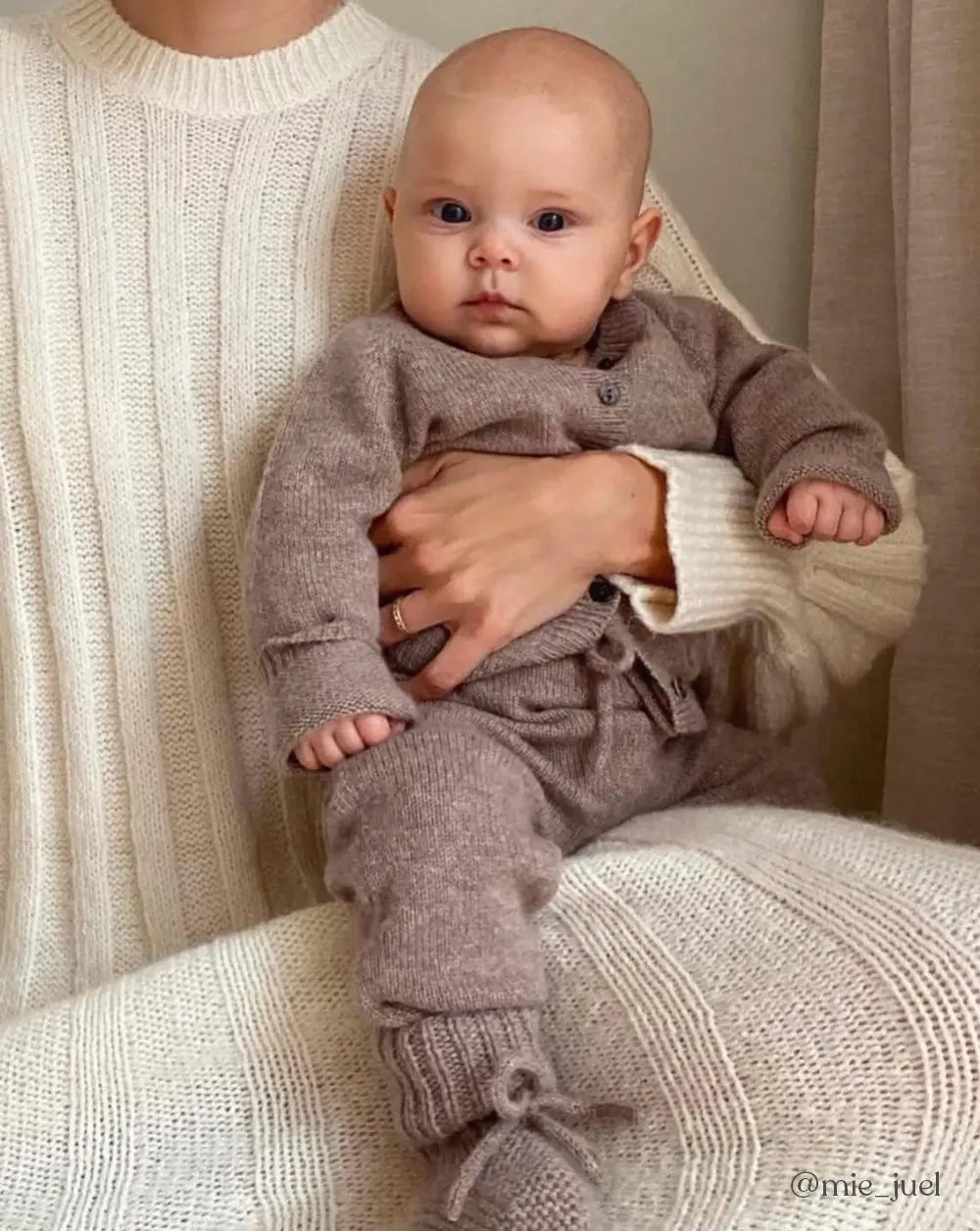Baby wearing Lalaby knitted Alpha shoes, Bobbie cardigan and Stormy pants in toast brown cashmere