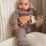 Baby wearing Lalaby knitted Alpha shoes, Bobbie cardigan and Stormy pants in toast brown cashmere