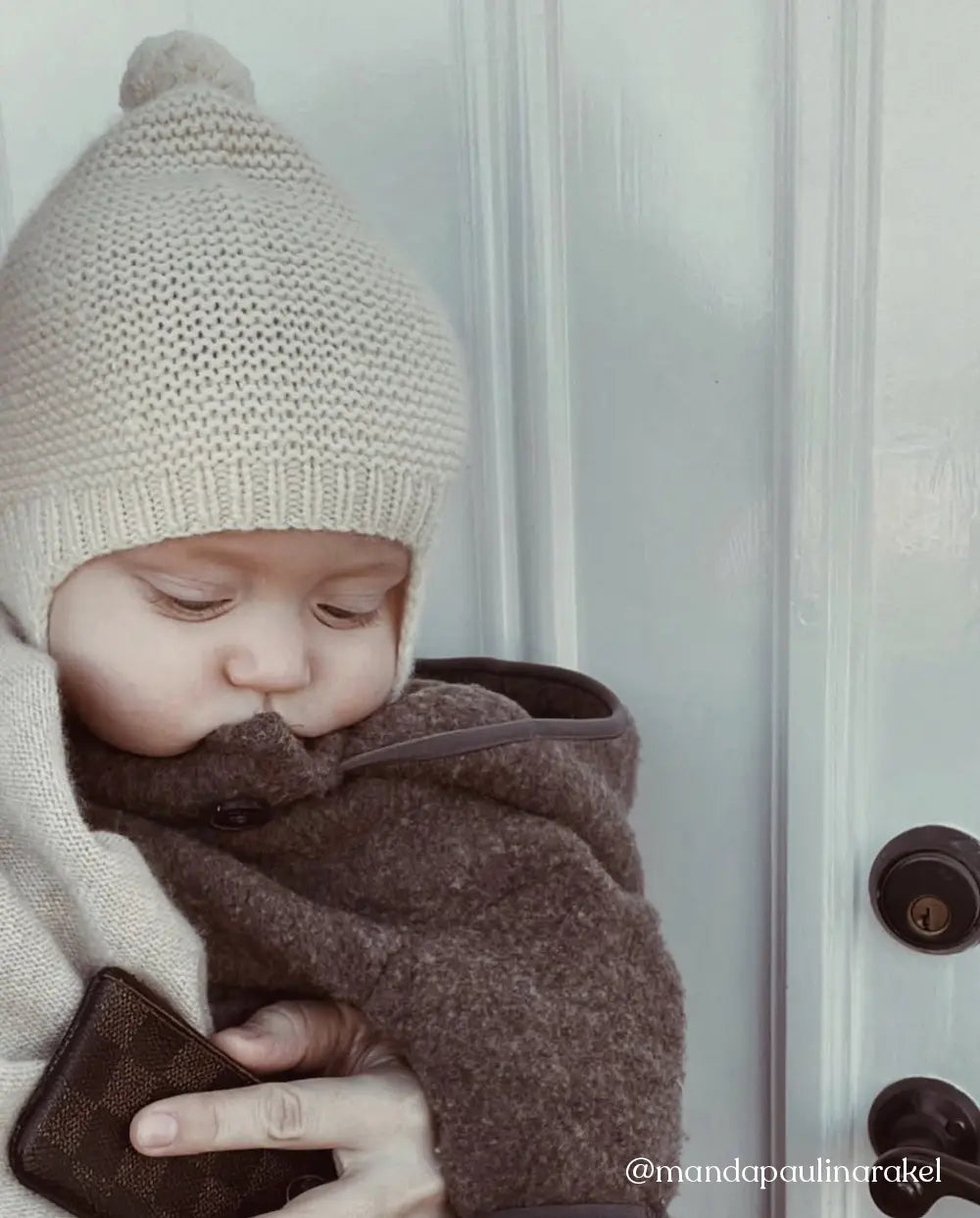 Baby wearing a Lalaby Bobo hat in powder pink cashmere