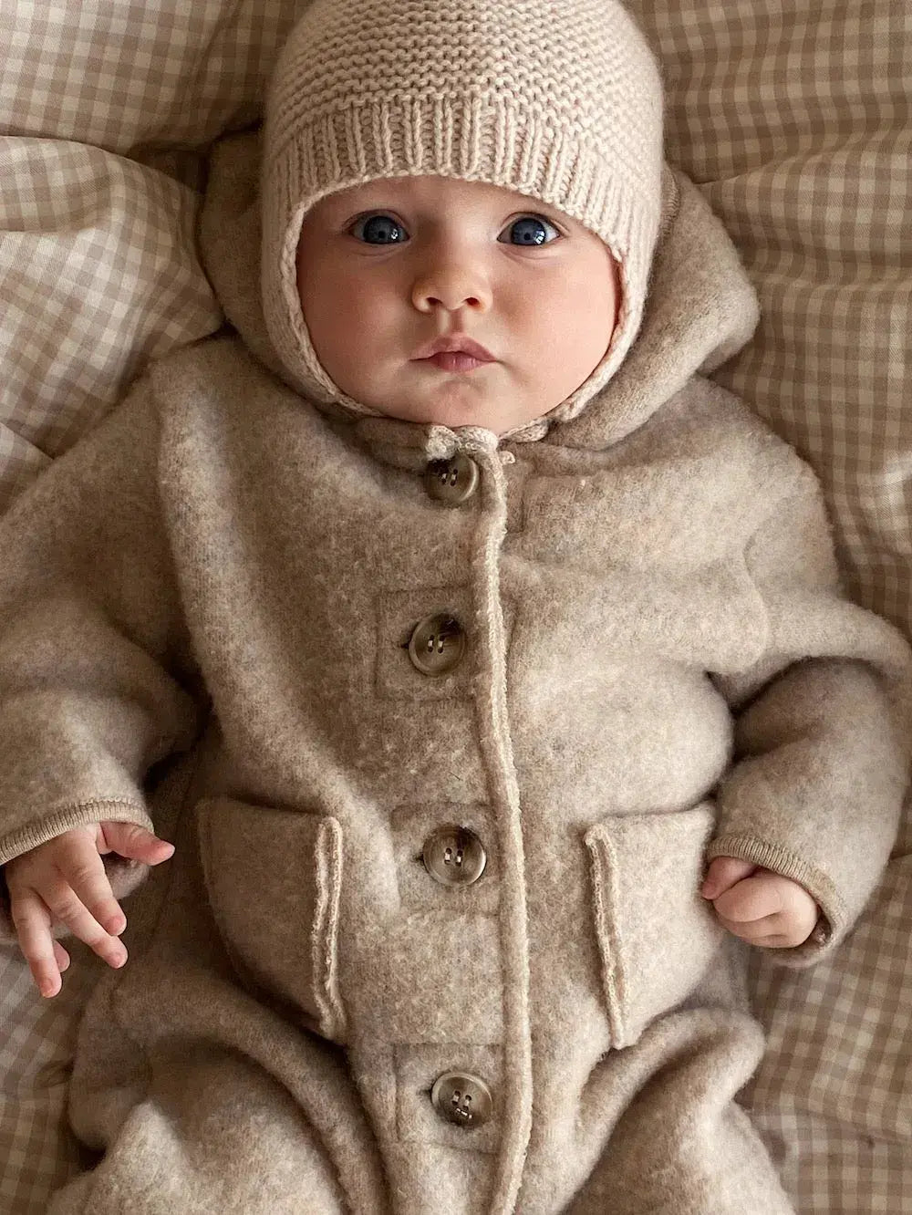 Baby wearing a Lalaby Bobo hat in powder pink cashmere