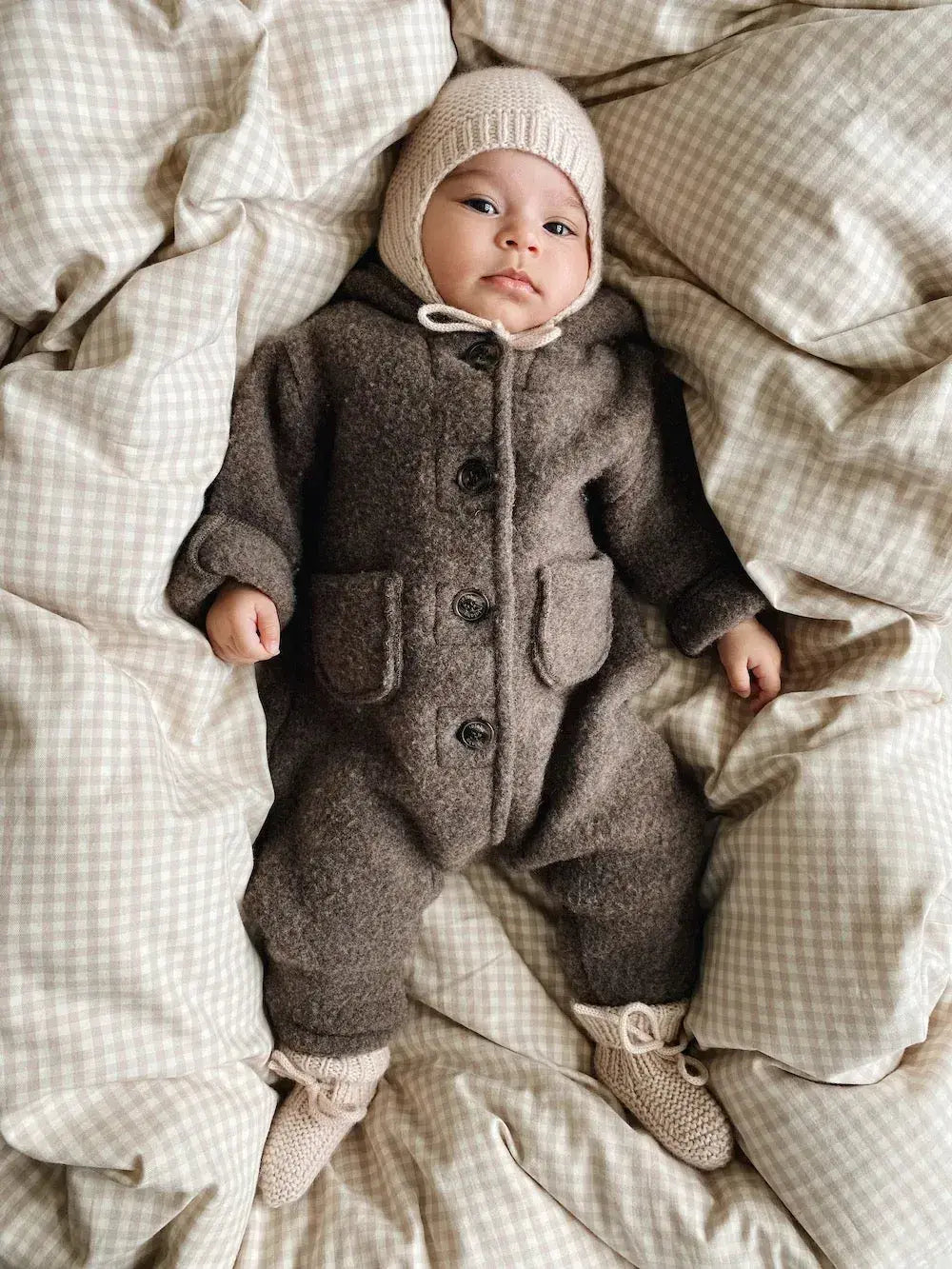 Baby wearing a Lalaby Bobo hat in powder pink cashmere