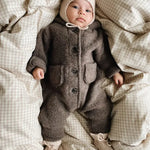 Baby wearing a Lalaby Bobo hat in powder pink cashmere