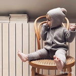 Baby wearing Lalaby knitted Bobo hat in toast brown cashmere
