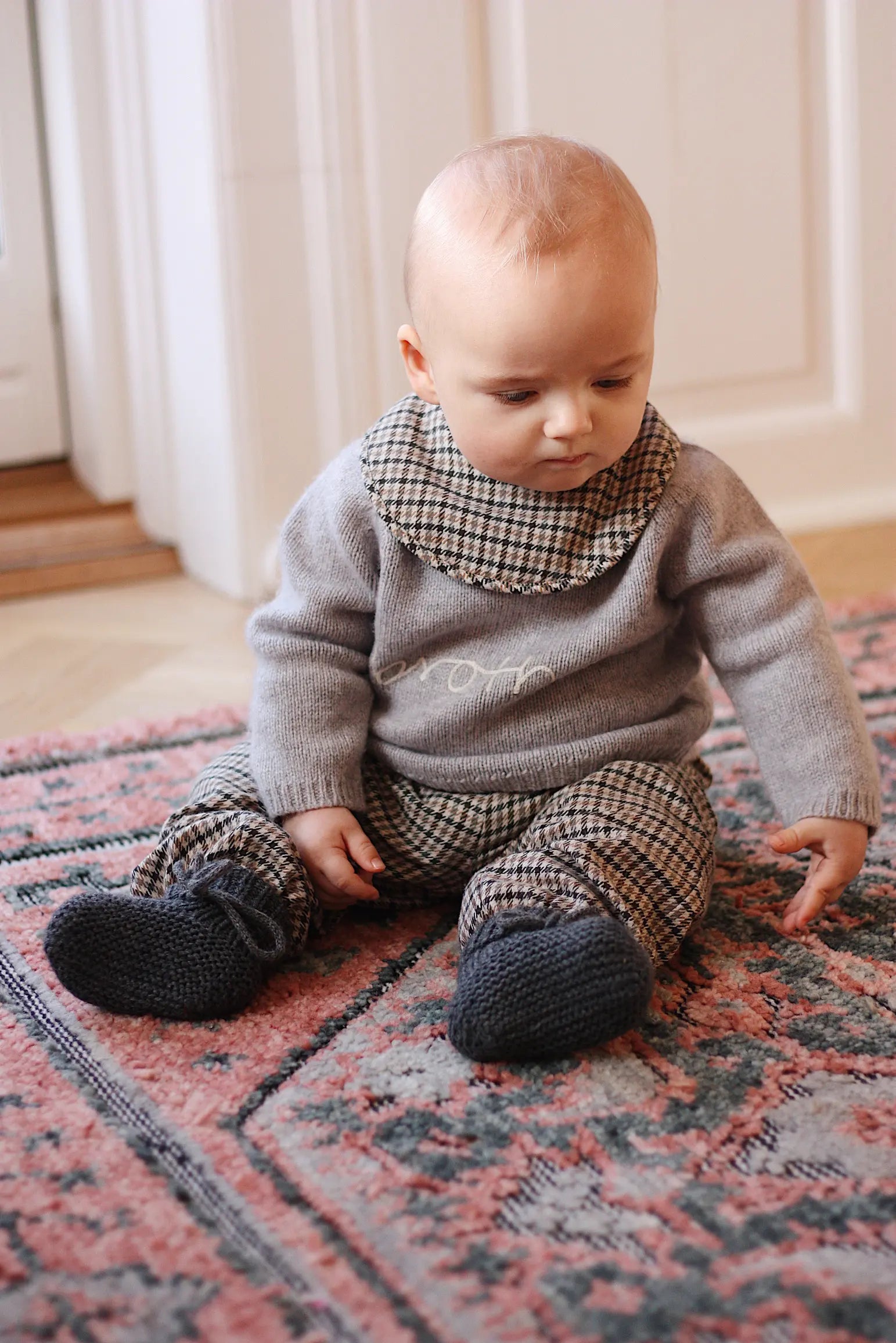 Baby boy wearing Lalaby Brother baby sweater in a grey baby wool, yak and cashmere blend