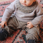Baby boy wearing Lalaby Brother baby sweater in a grey baby wool, yak and cashmere blend