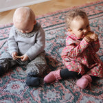 Baby boy wearing Lalaby Brother baby sweater in a grey baby wool, yak and cashmere blend