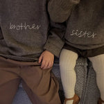 Siblings wearing Lalaby Brother and Sister sweater for kids in a millet brown baby wool, yak and cashmere blend