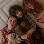 Boy wearing Lalaby Charlie trousers for kids in cookie brown organic cotton mega cord