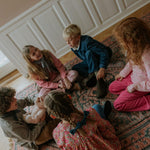 Girl wearing Lalaby Charlie trousers for kids in flamingo pink organic cotton mega cord