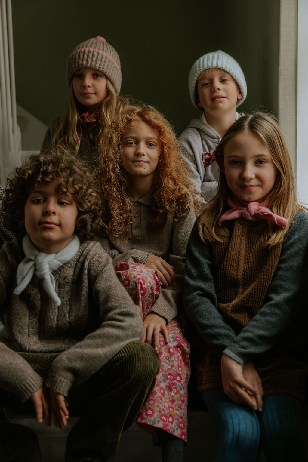 Girl wearing Lalaby Cole jumper in storm grey cashmere