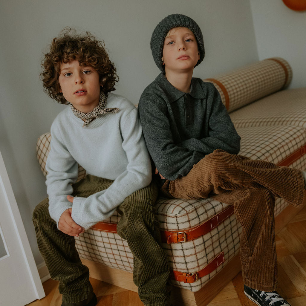 Boy wearing Lalaby Colin jumper in bluey light blue cashmere
