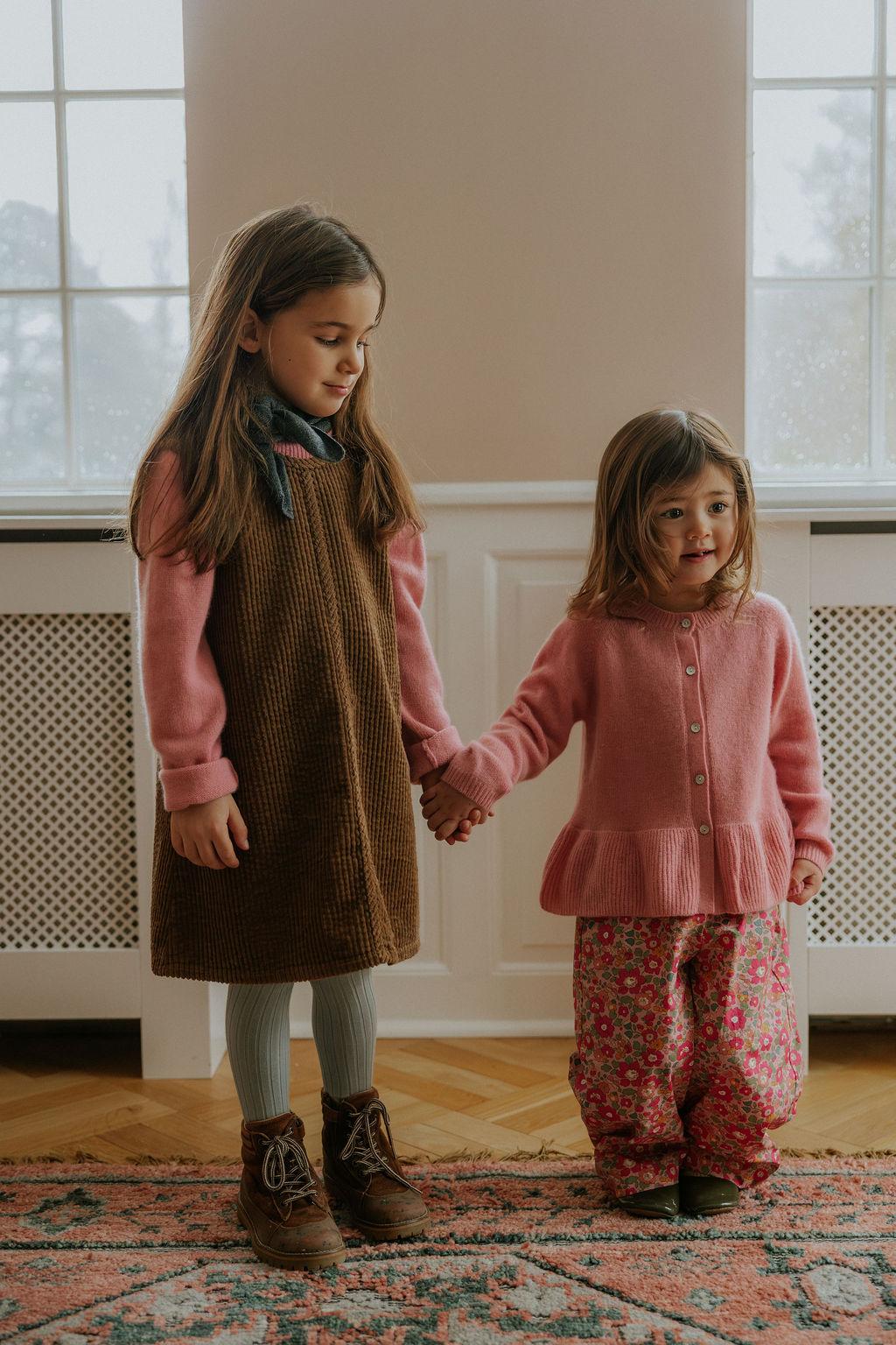 Girl wearing Lalaby Colin jumper in sorbet pink cashmere