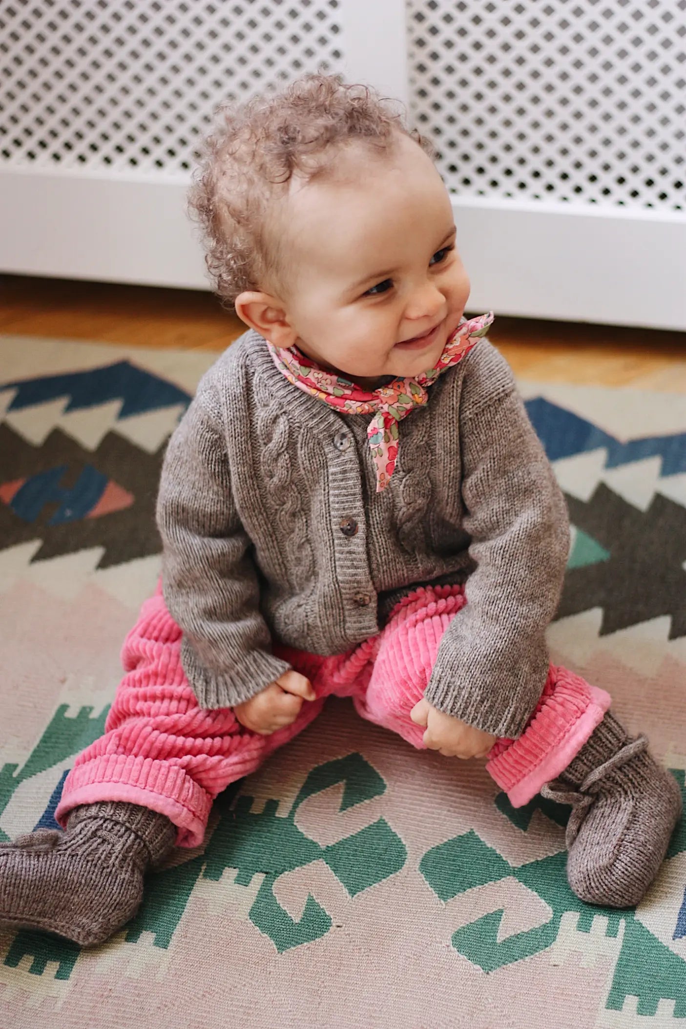 Baby girl wearing Lalaby Cony baby shoes in a millet brown baby wool, yak and cashmere blend