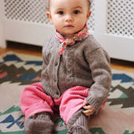 Baby girl wearing Lalaby Cony baby shoes in a millet brown baby wool, yak and cashmere blend