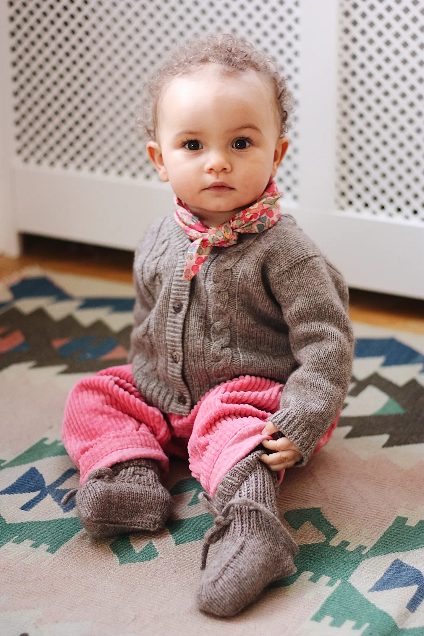 Baby girl wearing Lalaby Cony baby shoes in a millet brown baby wool, yak and cashmere blend