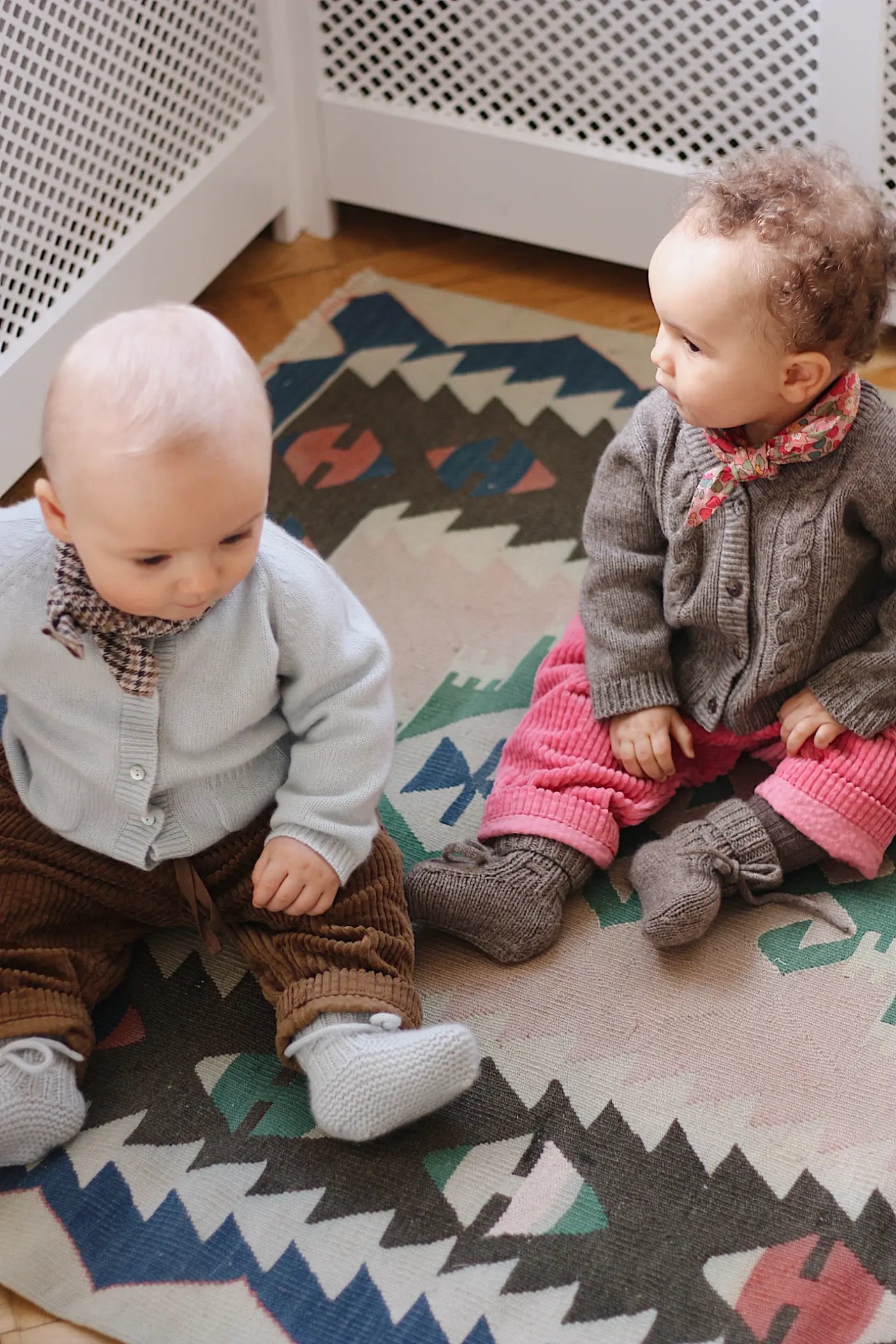 Baby girl wearing Lalaby Cony baby shoes in a millet brown baby wool, yak and cashmere blend