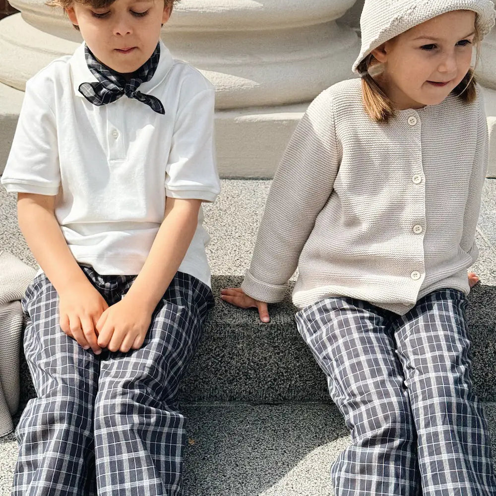 Boy wearing Lalaby Eddie scarf for kids in blue check organic cotton