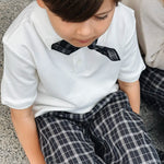 Boy wearing Lalaby Eddie scarf for kids in blue check organic cotton