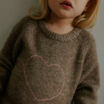 Girl wearing Lalaby ILY sweater for kids in millet brown baby wool, yak and cashmere blend