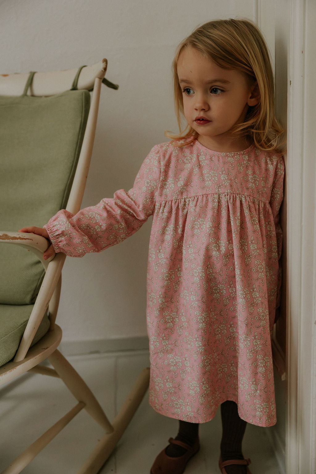 Girl wearing Lalaby Ines dress for kids in pink flower liberty cotton corduroy 